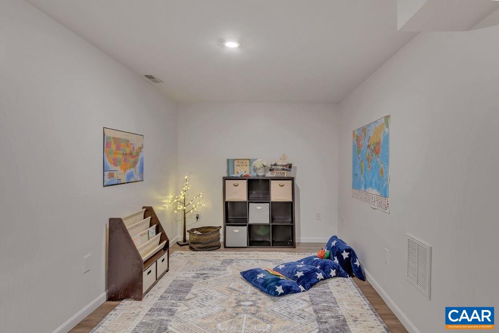 421 Rudolph Street Ruckersville, VA 22968 - Photo 39 of 42 a bed room with furniture and book shelf