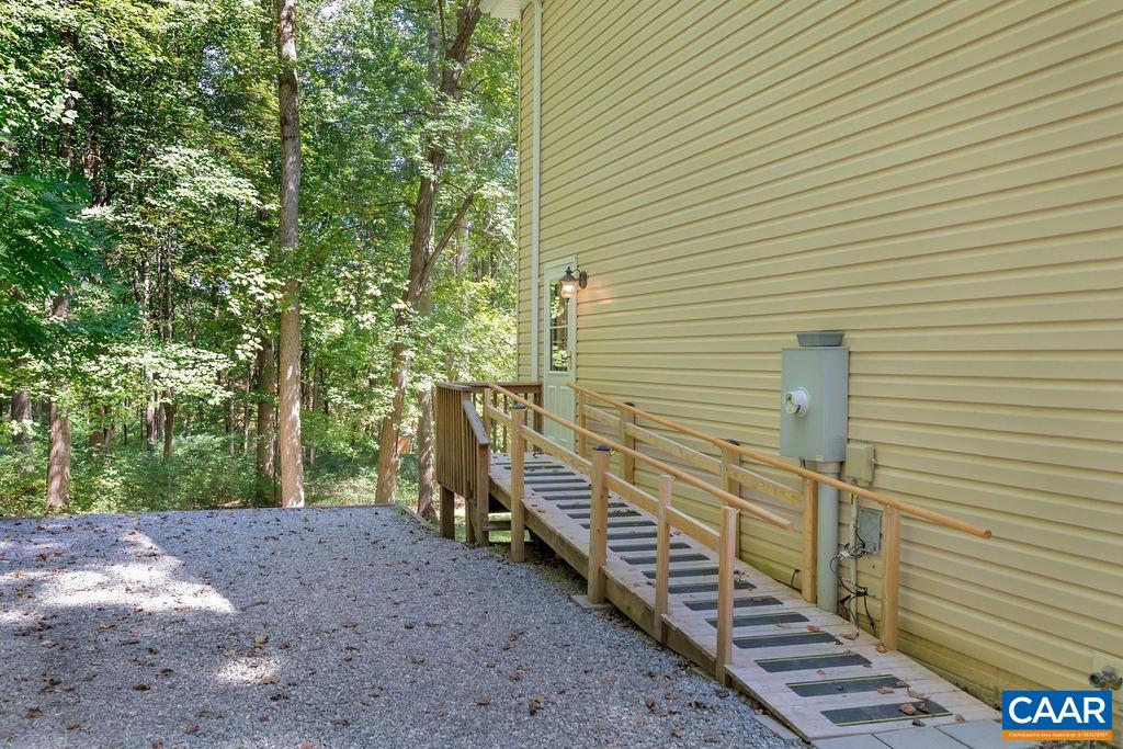421 Rudolph Street Ruckersville, VA 22968 - Photo 7 of 42 a view of a backyard with stairs and wooden fence