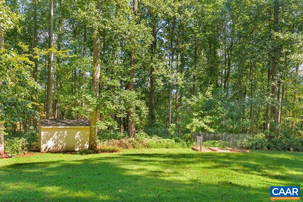 421 Rudolph Street Ruckersville, VA 22968 - Photo 8 of 42 a garden with trees in the background