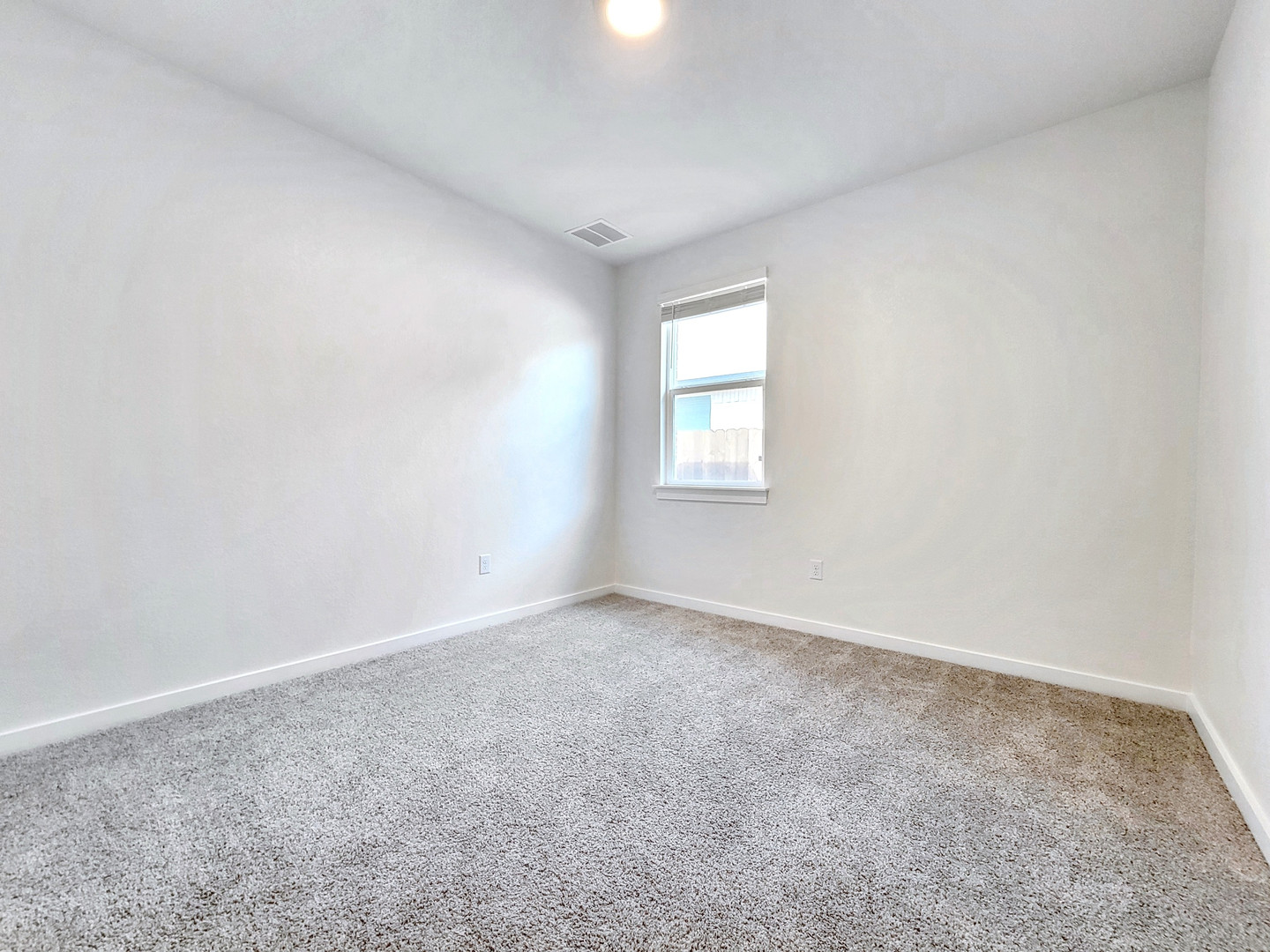 2329 Gabriels Horn Road Leander, TX 78641 - Photo 18 of 23 A spacious room offers comfortable carpeting, ready for personalization.