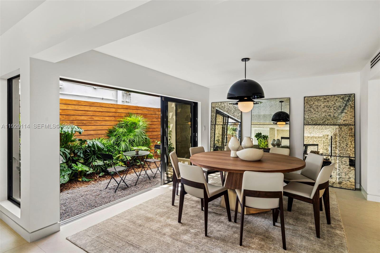 1815 Fairhaven Place Miami, FL 33133 - Photo 12 of 59 a dining room with furniture window and wooden floor