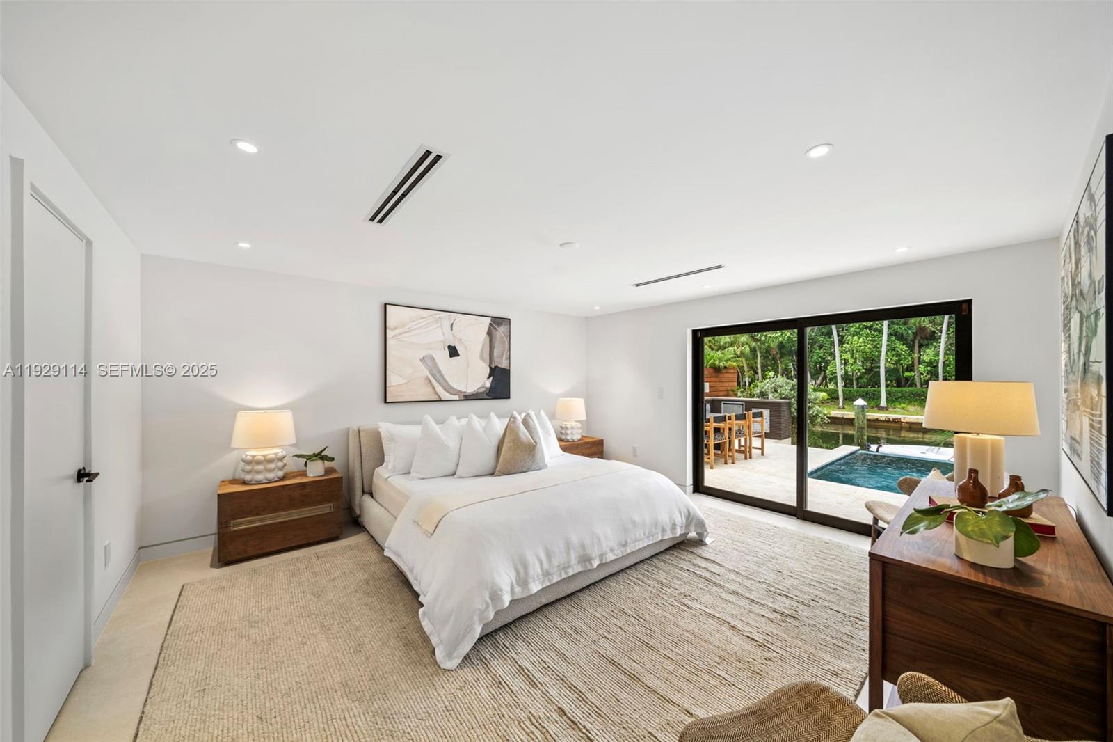 1815 Fairhaven Place Miami, FL 33133 - Photo 32 of 59 a bedroom with a bed and a large window