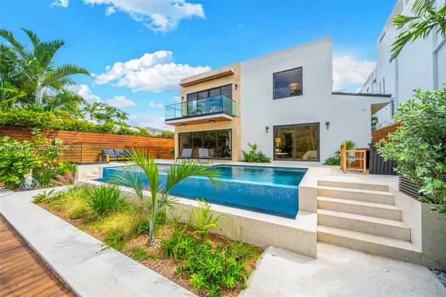 a view of a swimming pool with a patio