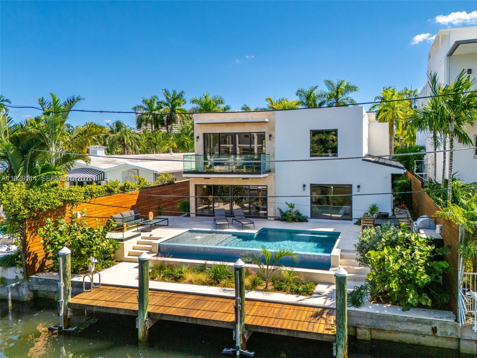 1815 Fairhaven Place Miami, FL 33133 - Photo 45 of 59 a view of backyard with swimming pool and seating area