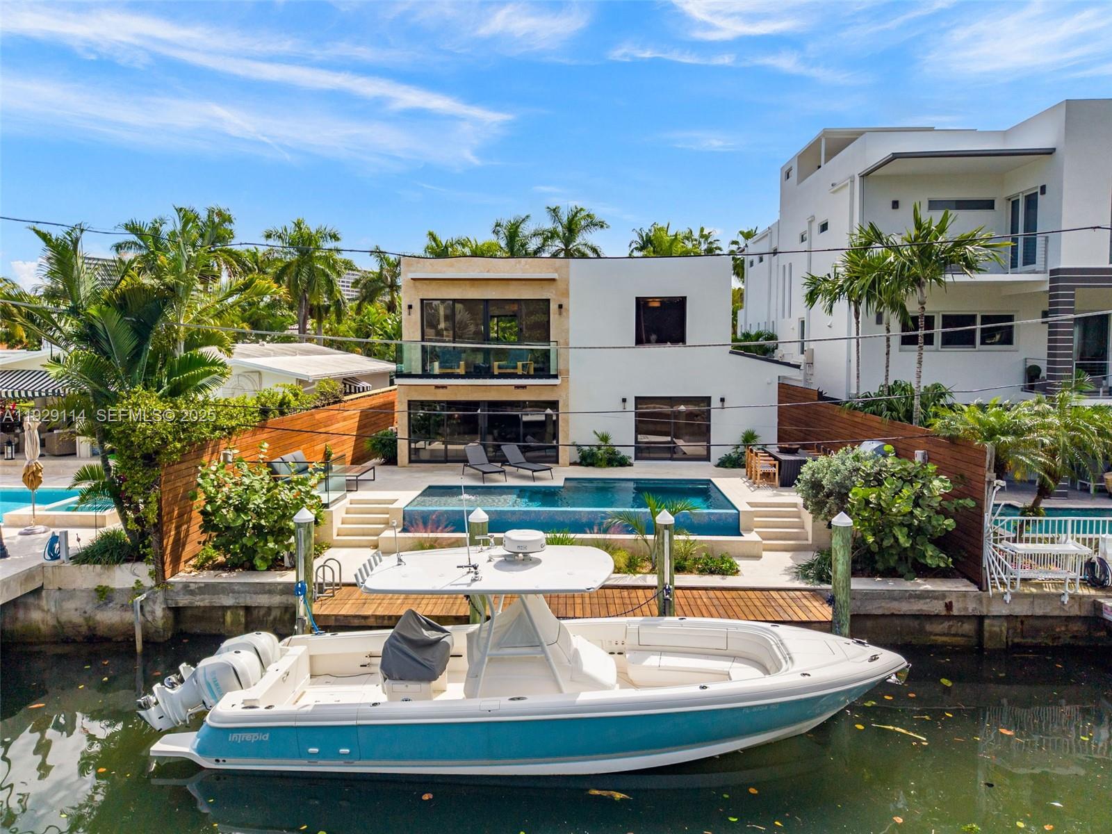 1815 Fairhaven Place Miami, FL 33133 - Photo 52 of 59 a view of a swimming pool with a patio