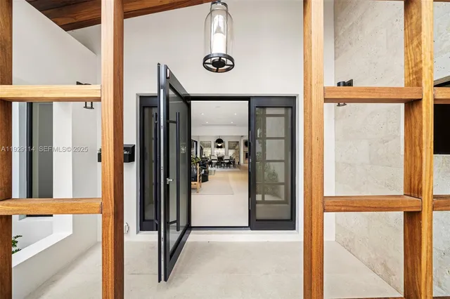 a dining room with furniture window and wooden floor