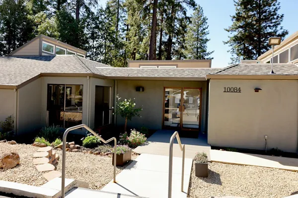 a front view of a house with patio