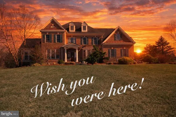 a front view of a house with a street sign