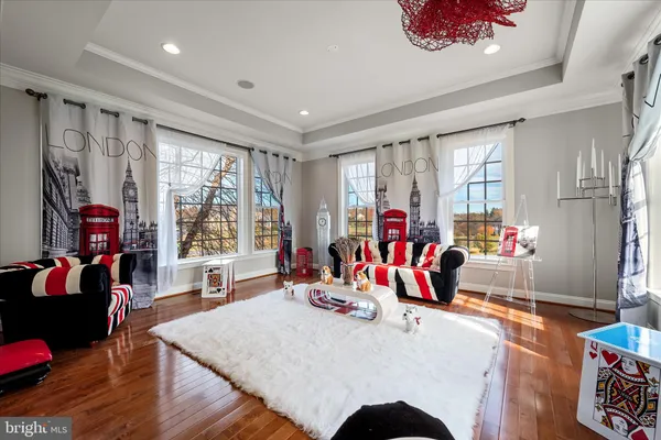 a living room with a fireplace and a large window