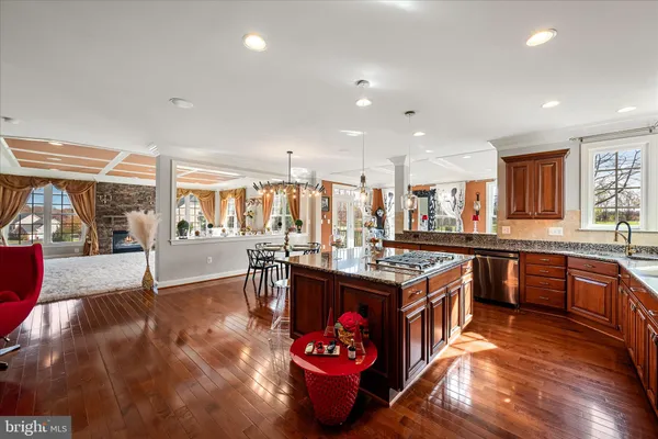 a view of a hallway view with wooden floor and staircase