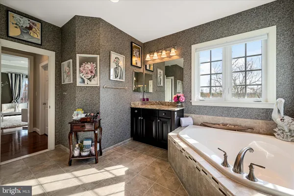 a bedroom with furniture and a flat screen tv