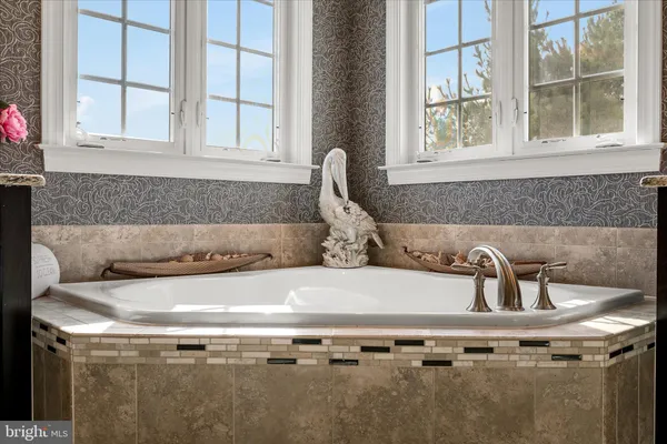 a room with table soccer and a flat screen tv