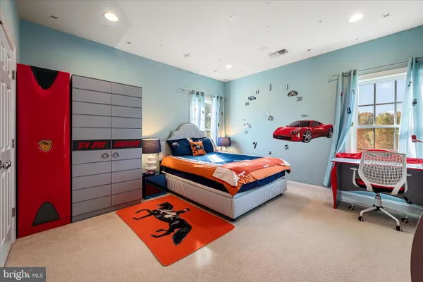 a view of a livingroom with a ceiling fan and window