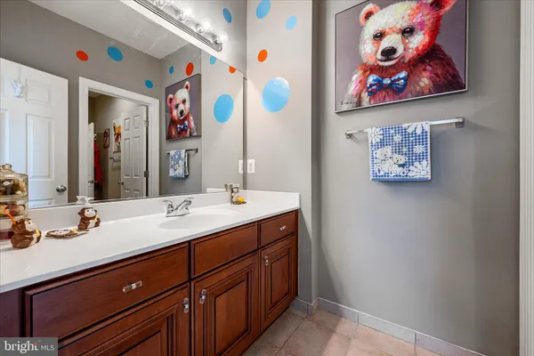 a roof deck with a dining table and chairs with wooden floor