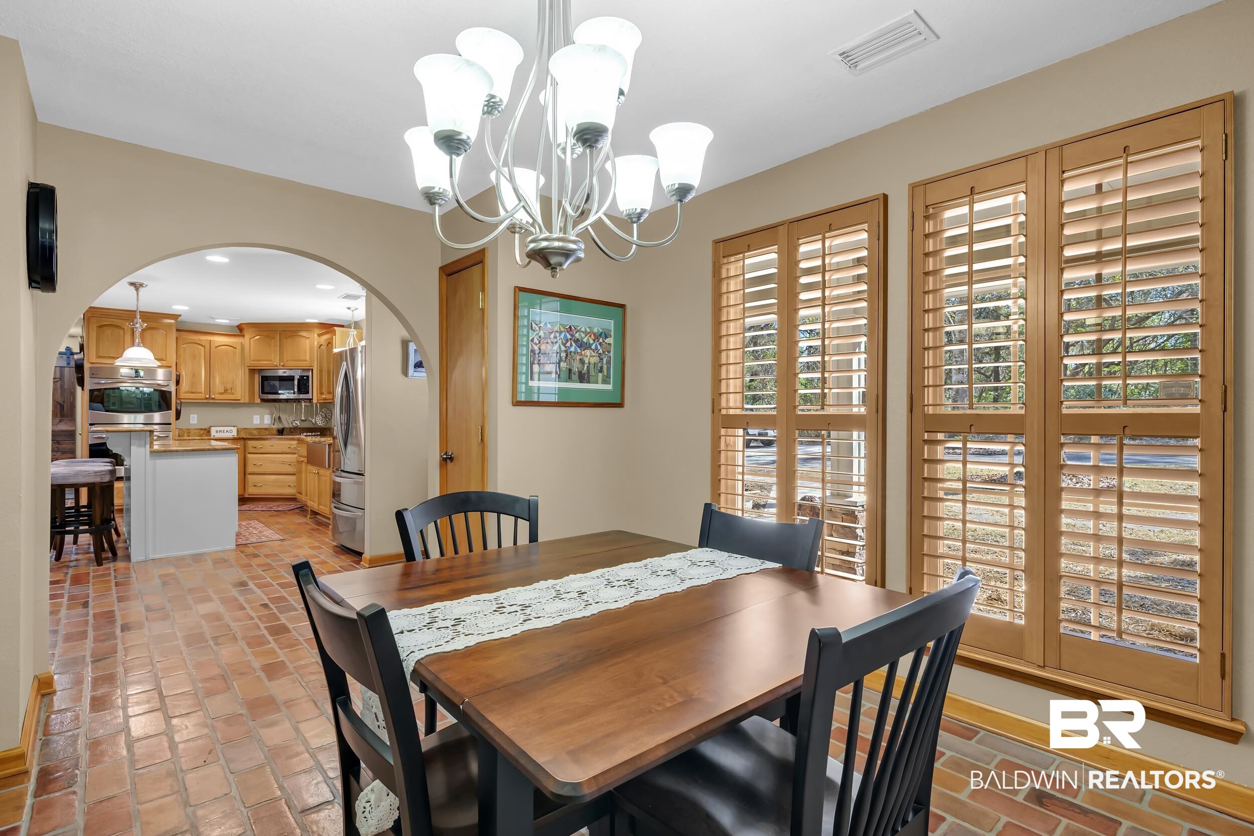 22929 Highway 98 Foley, AL 36535 - Photo 11 of 54 Dining room with brick flooring, arched walkways, and a chandelier