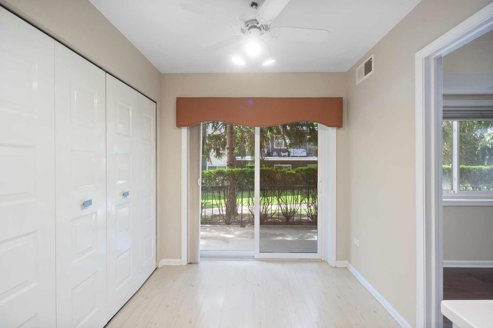 4949 Golf Road, Unit 101 Skokie, IL 60077 - Photo 10 of 22 a view of an empty room with a window