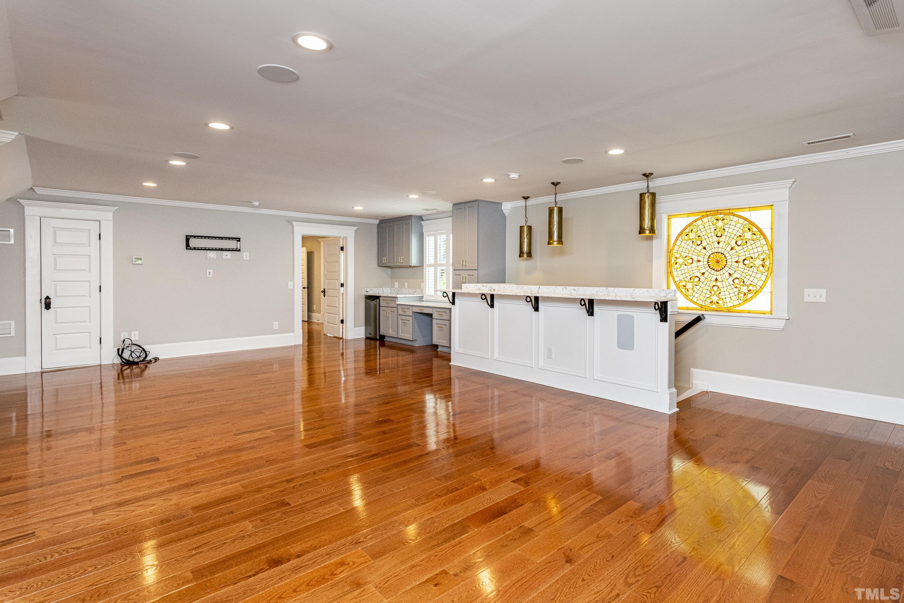 208 Ashe Avenue Raleigh, NC 27605 - Photo 38 of 66 a view of a kitchen with furniture and wooden floor