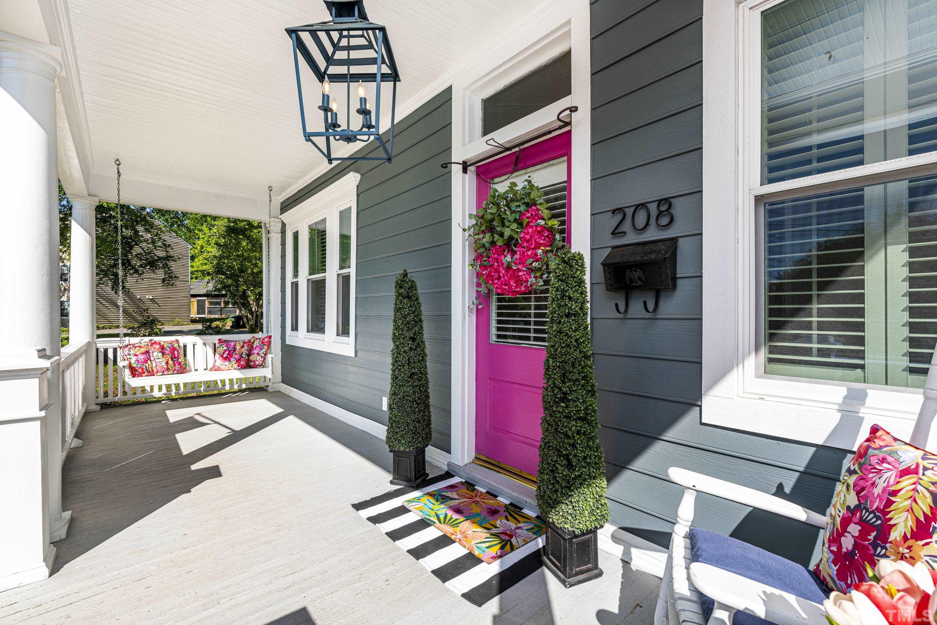 208 Ashe Avenue Raleigh, NC 27605 - Photo 4 of 66 a bench is sitting in front of a building