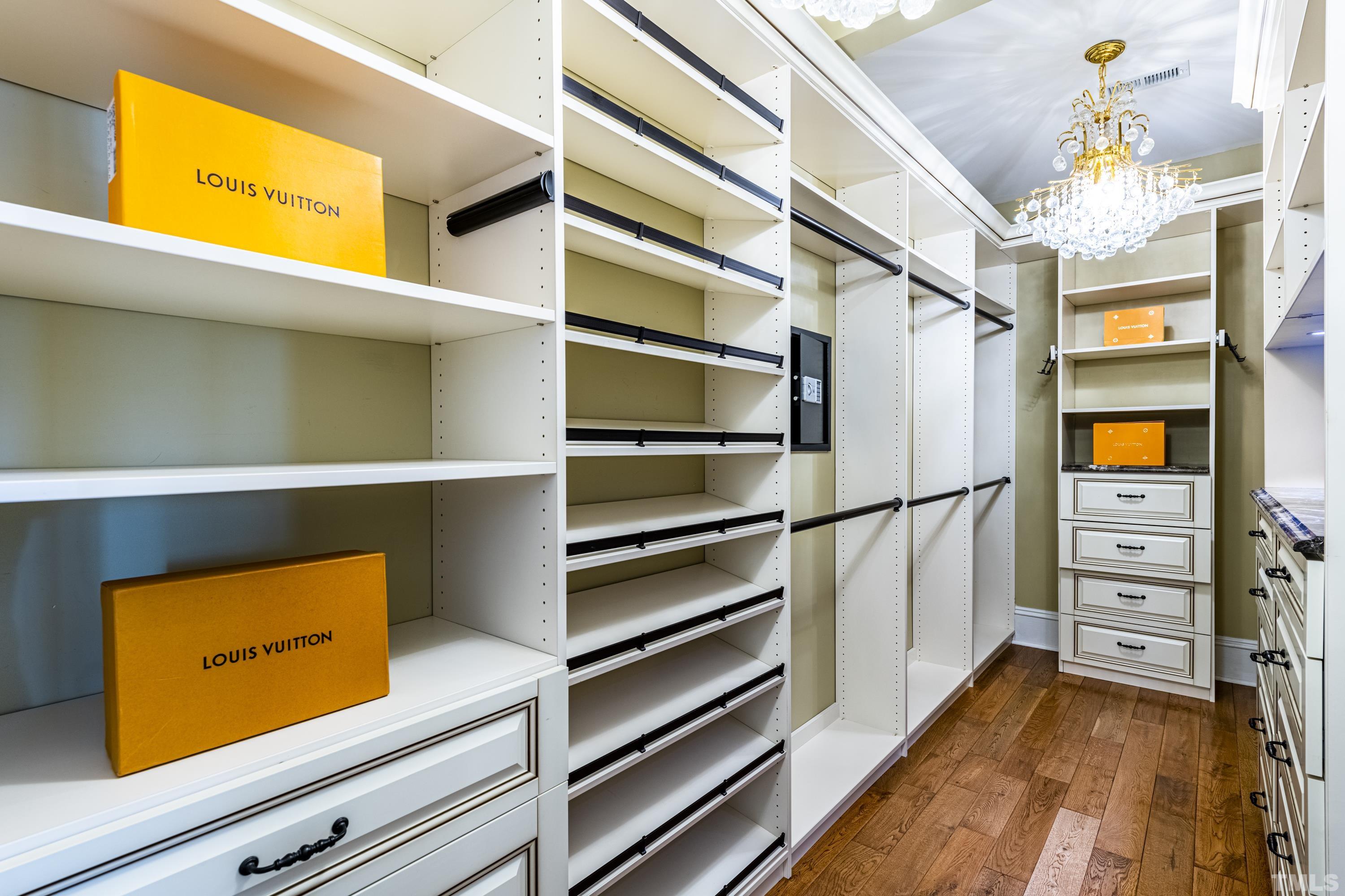 208 Ashe Avenue Raleigh, NC 27605 - Photo 48 of 66 a view of walk in closet with clothes and shoes