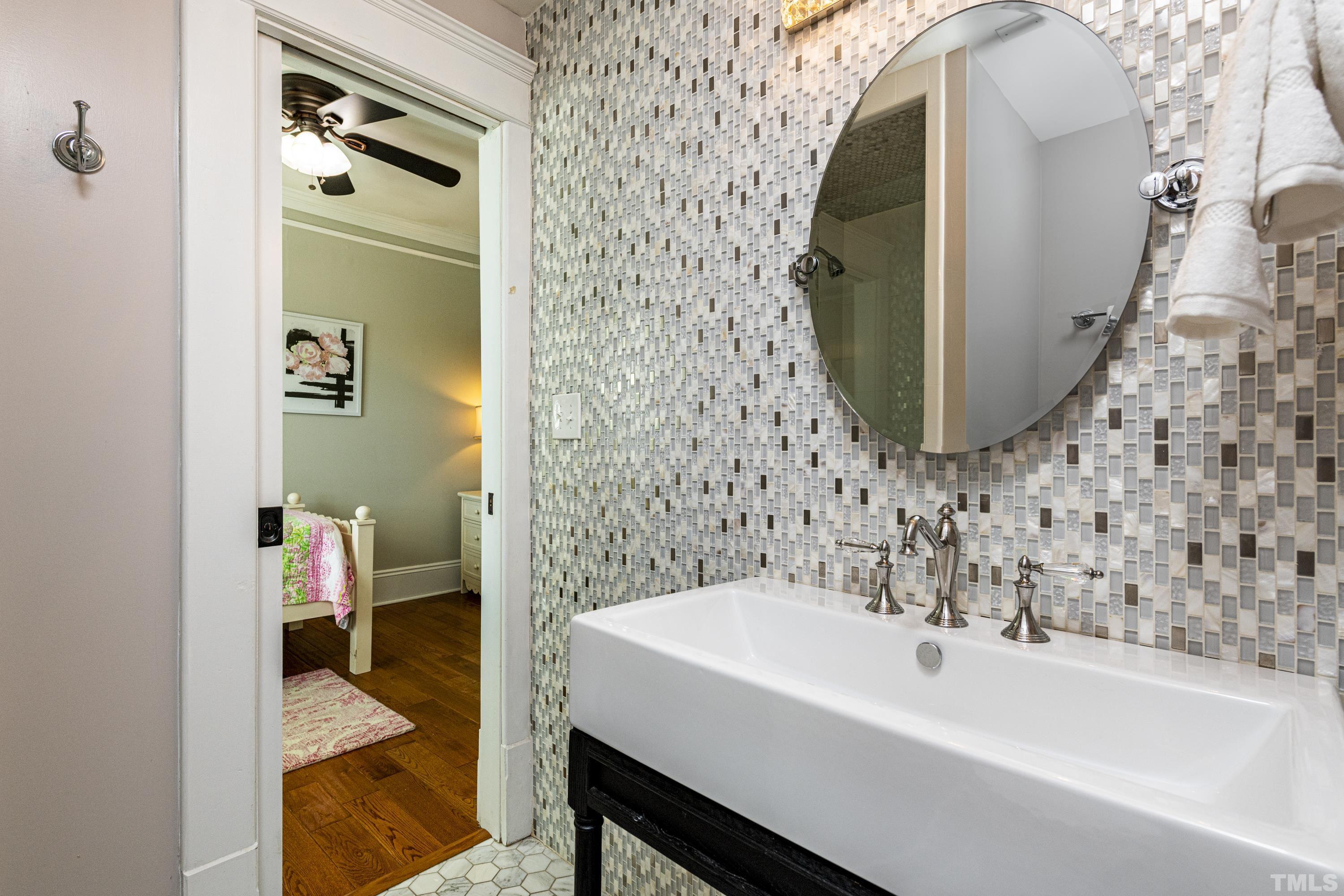 208 Ashe Avenue Raleigh, NC 27605 - Photo 50 of 66 a bathroom with a sink and mirror with toilet