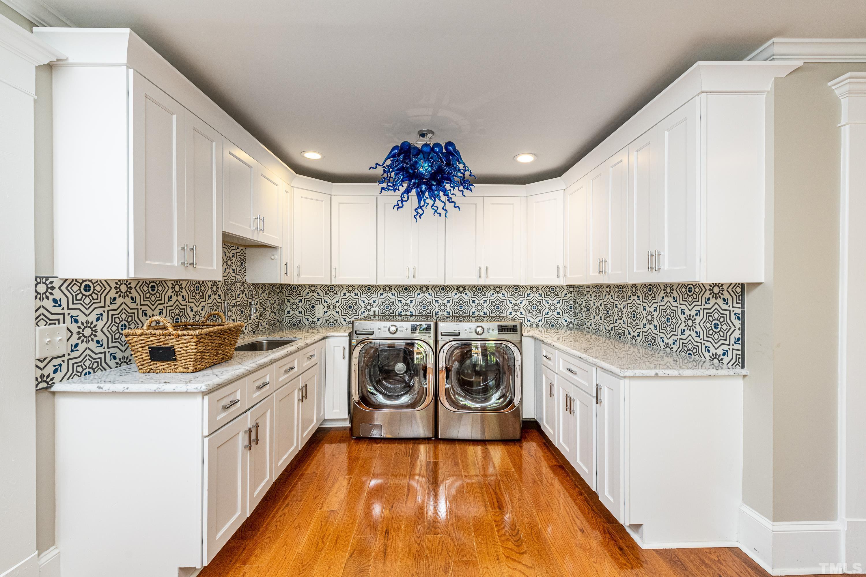 208 Ashe Avenue Raleigh, NC 27605 - Photo 53 of 66 a kitchen with a stove top oven sink and cabinets