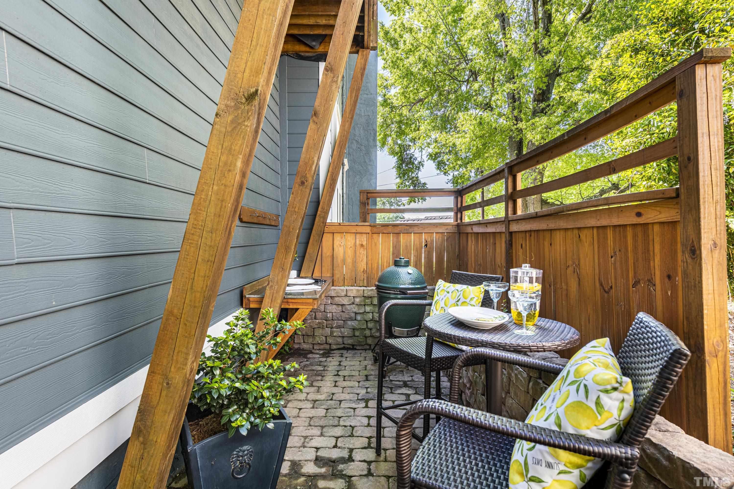 208 Ashe Avenue Raleigh, NC 27605 - Photo 56 of 66 a backyard of a house with outdoor seating