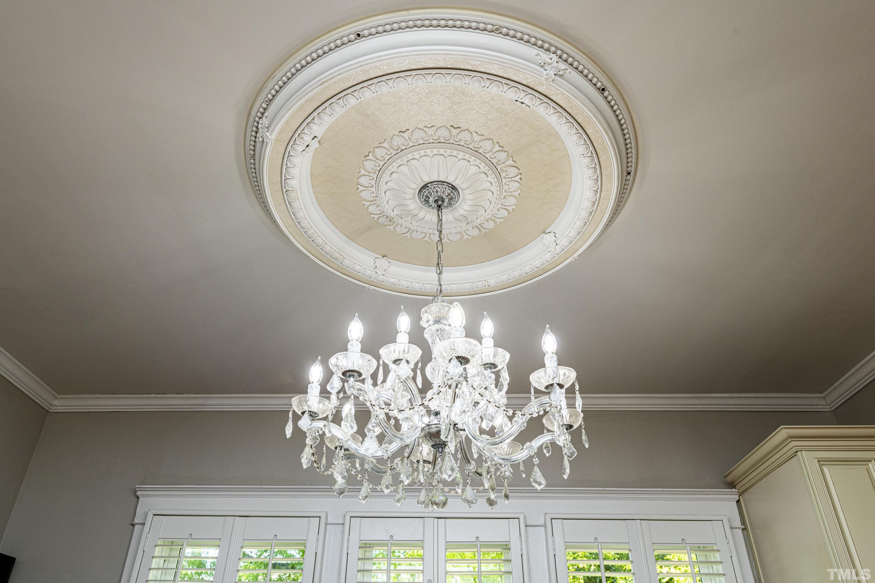 208 Ashe Avenue Raleigh, NC 27605 - Photo 62 of 66 a close view of a chandelier in living room