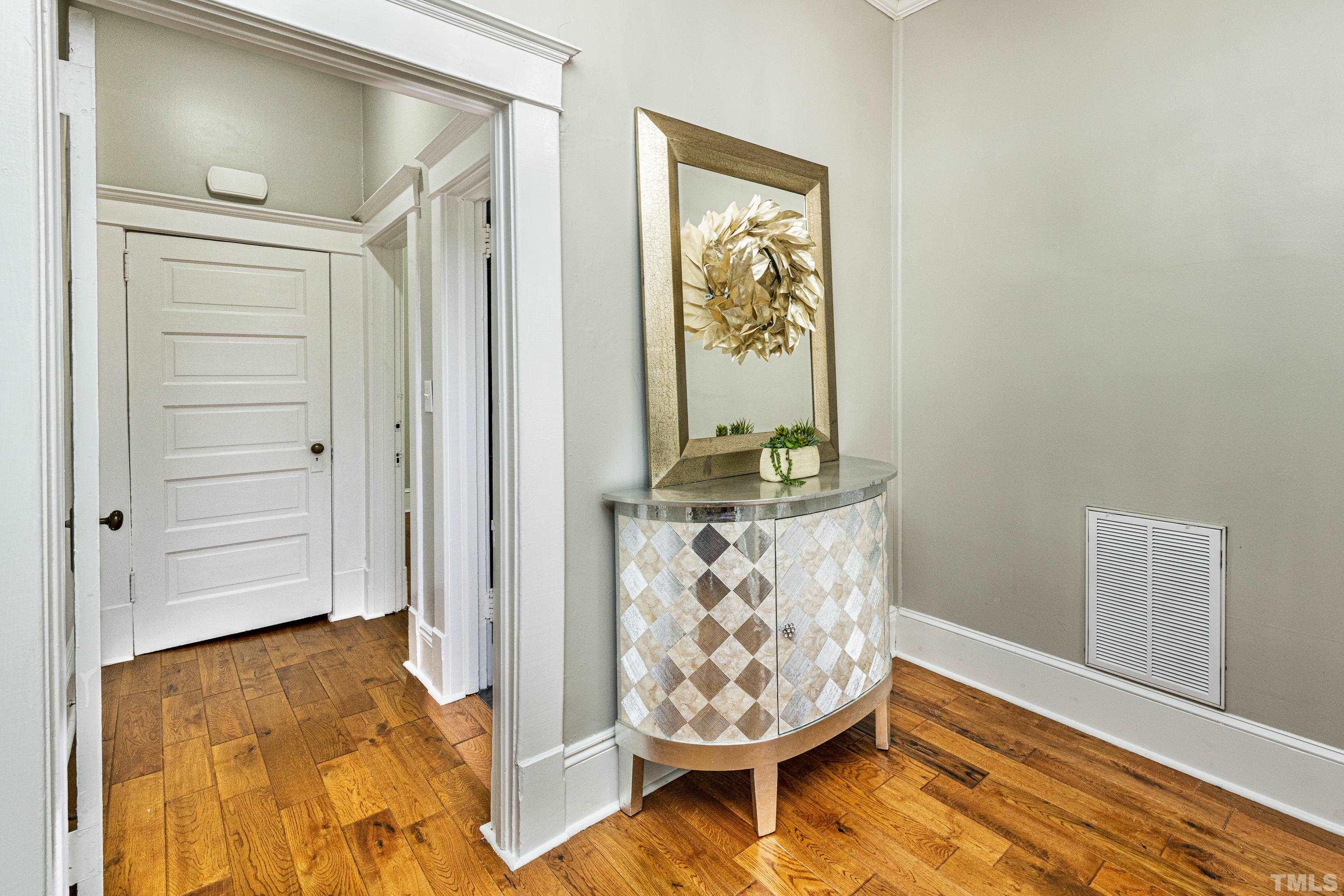 208 Ashe Avenue Raleigh, NC 27605 - Photo 7 of 66 view of an entryway with wooden floor