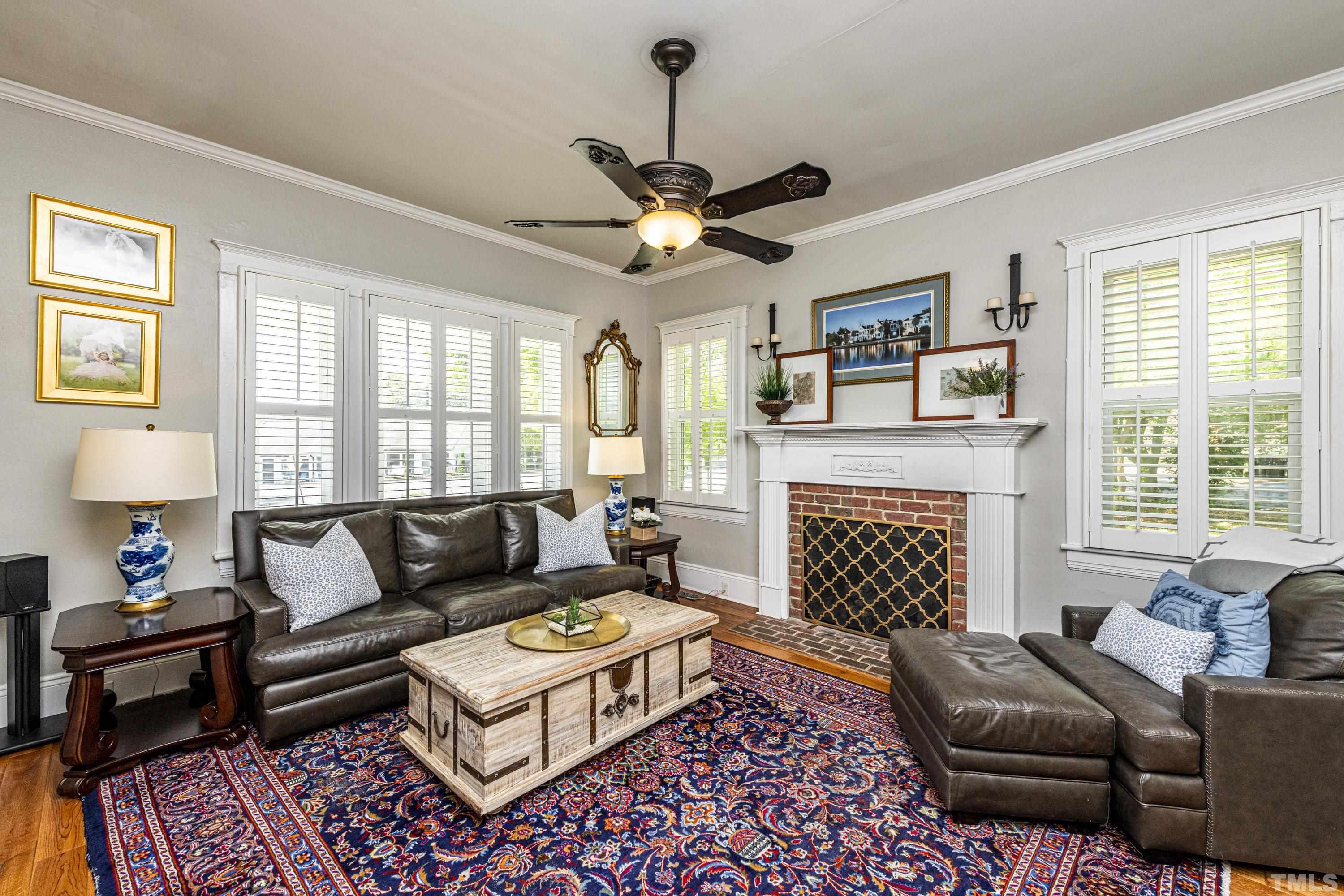 208 Ashe Avenue Raleigh, NC 27605 - Photo 8 of 66 a living room with furniture a fireplace and a window
