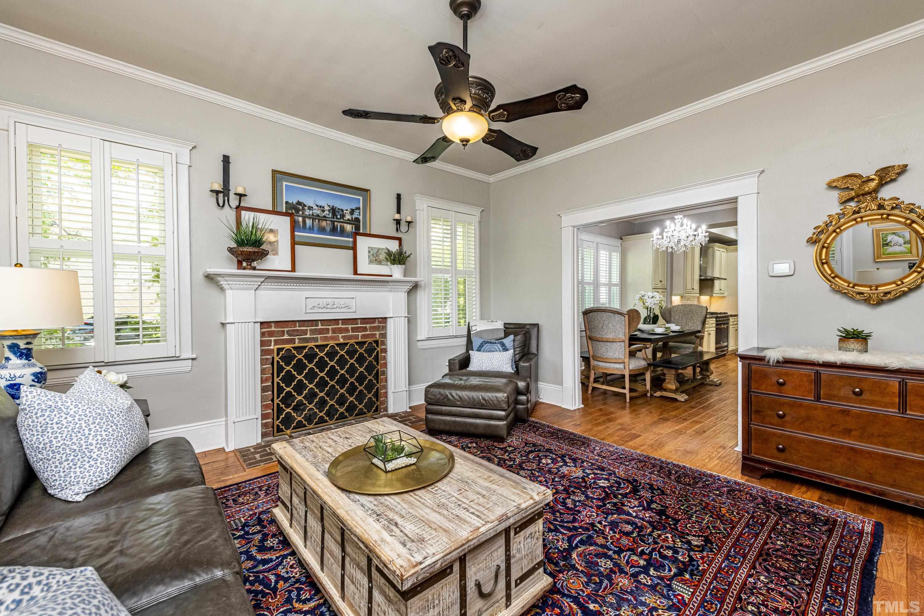 208 Ashe Avenue Raleigh, NC 27605 - Photo 10 of 66 a living room with furniture and a fireplace