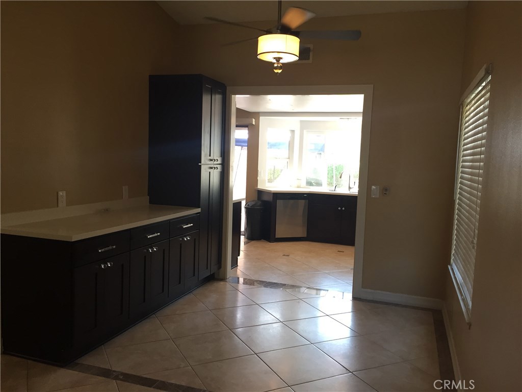50 Village Loop Road Phillips Ranch, CA 91766 - Photo 11 of 48 a spacious bathroom with a granite countertop sink a mirror and a bathtub