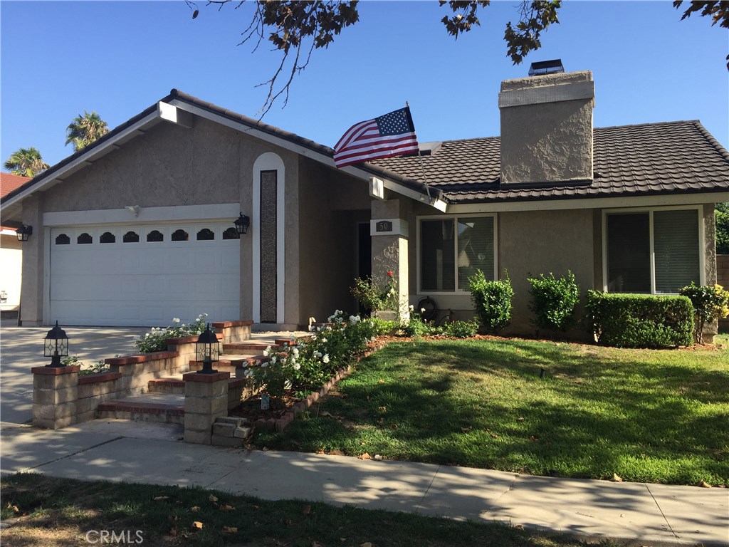 50 Village Loop Road Phillips Ranch, CA 91766 - Photo 2 of 48 a front view of house with yard