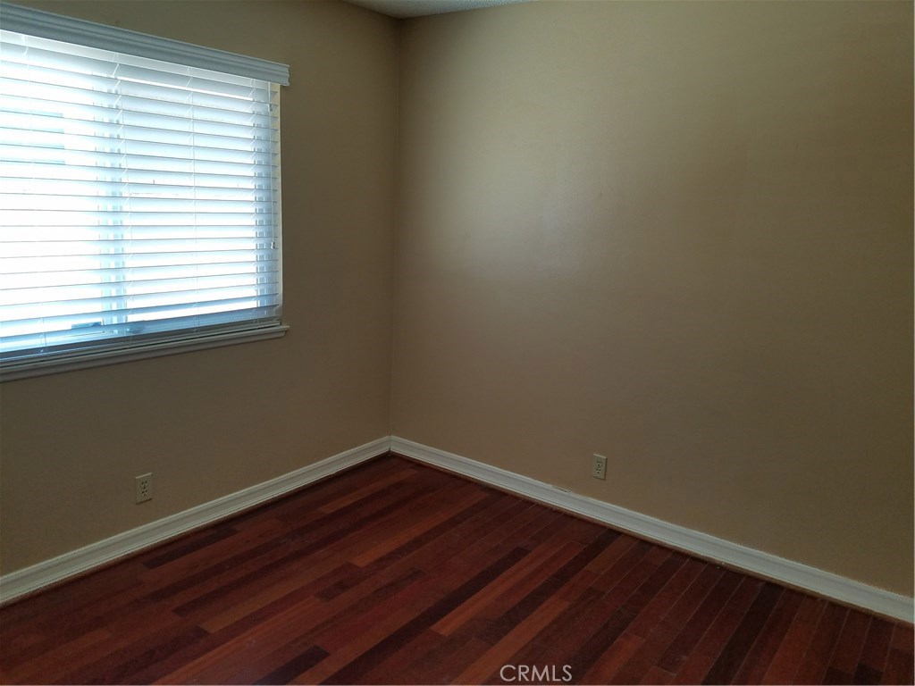 50 Village Loop Road Phillips Ranch, CA 91766 - Photo 23 of 48 a view of a small space with wooden floor and a window