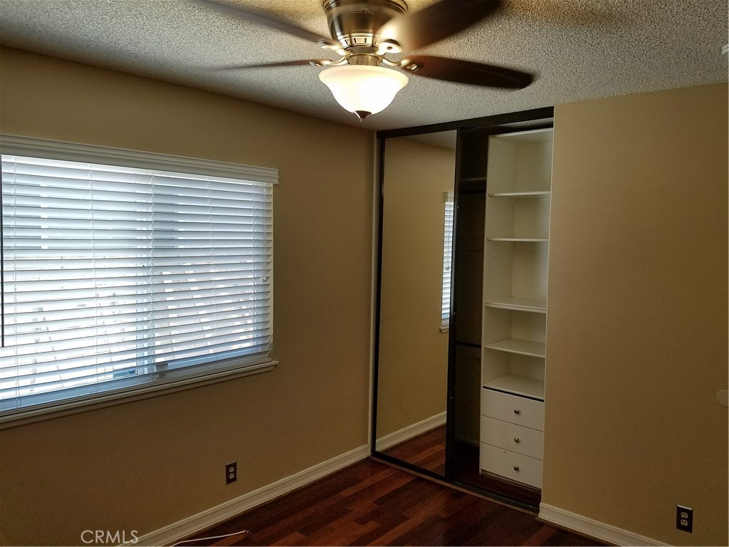 50 Village Loop Road Phillips Ranch, CA 91766 - Photo 30 of 48 a view of room with window and wooden floor