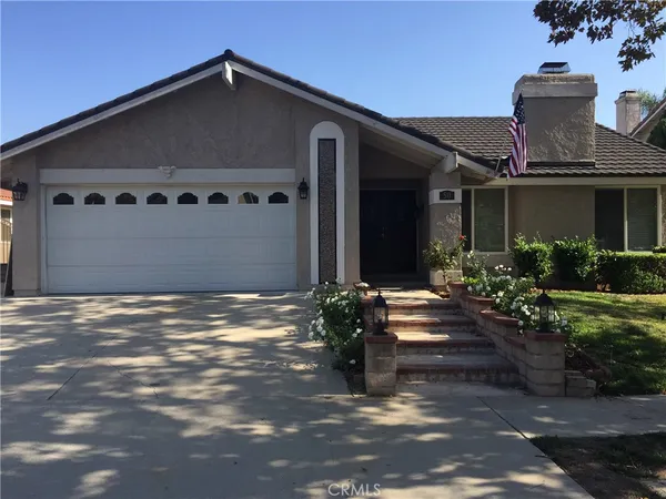 a front view of a house with yard