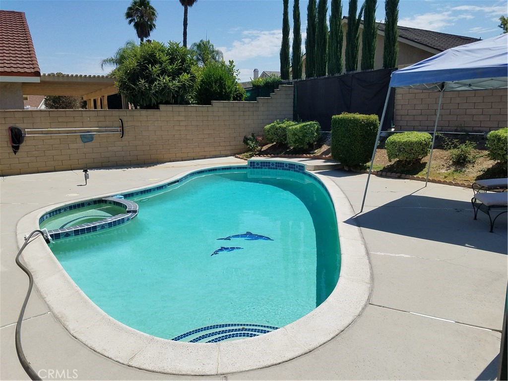 50 Village Loop Road Phillips Ranch, CA 91766 - Photo 37 of 48 a view of a swimming pool with a yard