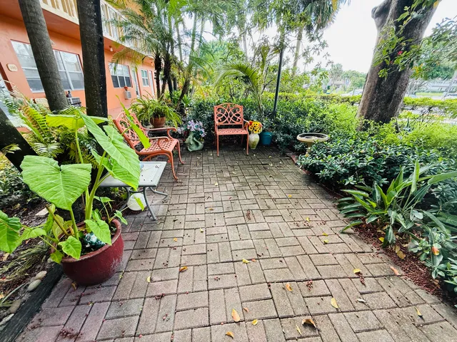 a bunch of flowers in front of house