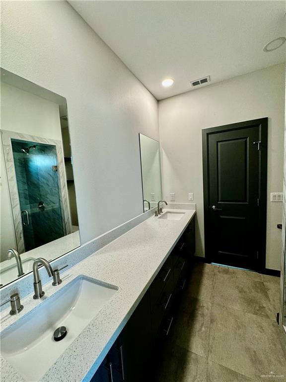 2705 Stablewood Mission, TX 78574 - Photo 12 of 15 a bathroom with a sink double vanity and a mirror