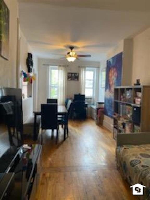 7608 3rd Avenue Brooklyn, NY 11209 - Photo 4 of 12 a living room with furniture and a fireplace
