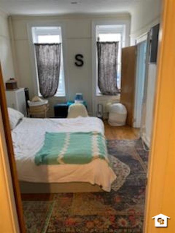 7608 3rd Avenue Brooklyn, NY 11209 - Photo 7 of 12 a living room with furniture