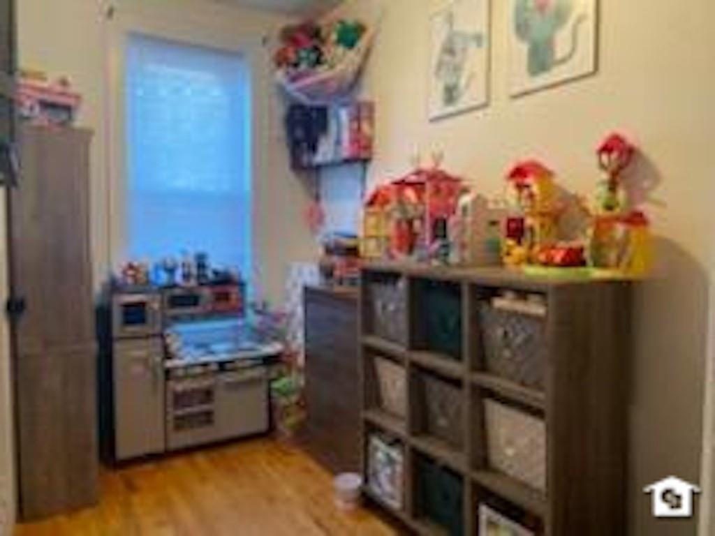 7608 3rd Avenue Brooklyn, NY 11209 - Photo 8 of 12 a kitchen with stainless steel appliances granite countertop a stove and cabinets