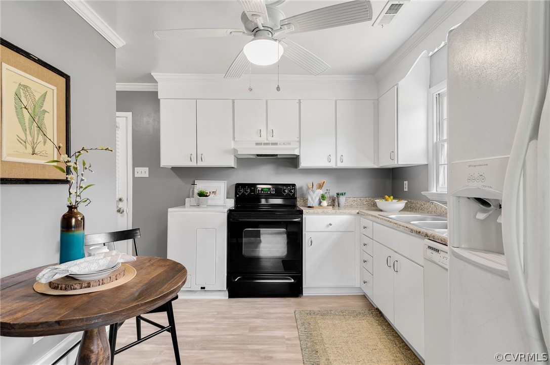 2364 Coxendale Road Chester, VA 23831 - Photo 8 of 21 a kitchen with a stove cabinets and a refrigerator
