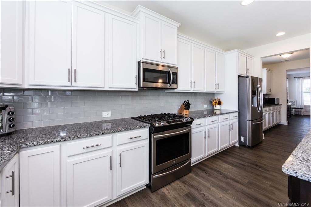 213 Morgan's Branch Road Belmont, NC 28012 - Photo 15 of 41 a kitchen with stainless steel appliances granite countertop a stove a sink and a refrigerator