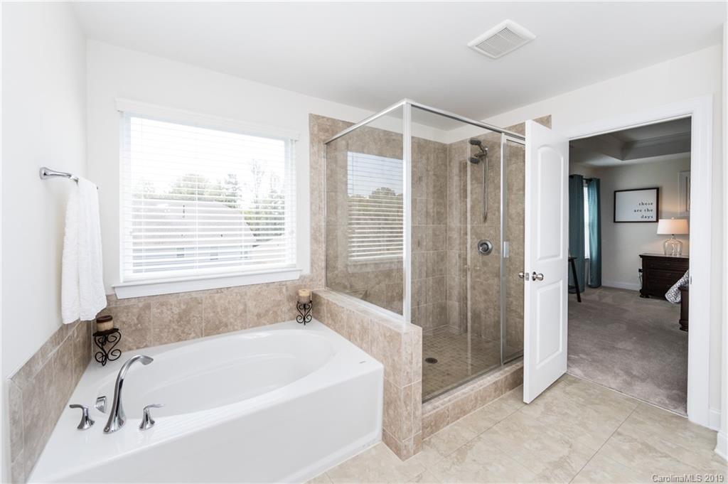 213 Morgan's Branch Road Belmont, NC 28012 - Photo 25 of 41 a bathroom with a bathtub and a shower