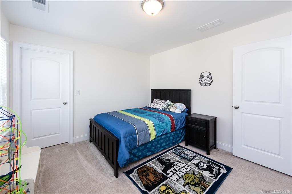 213 Morgan's Branch Road Belmont, NC 28012 - Photo 27 of 41 a bedroom with a bed and a window in it