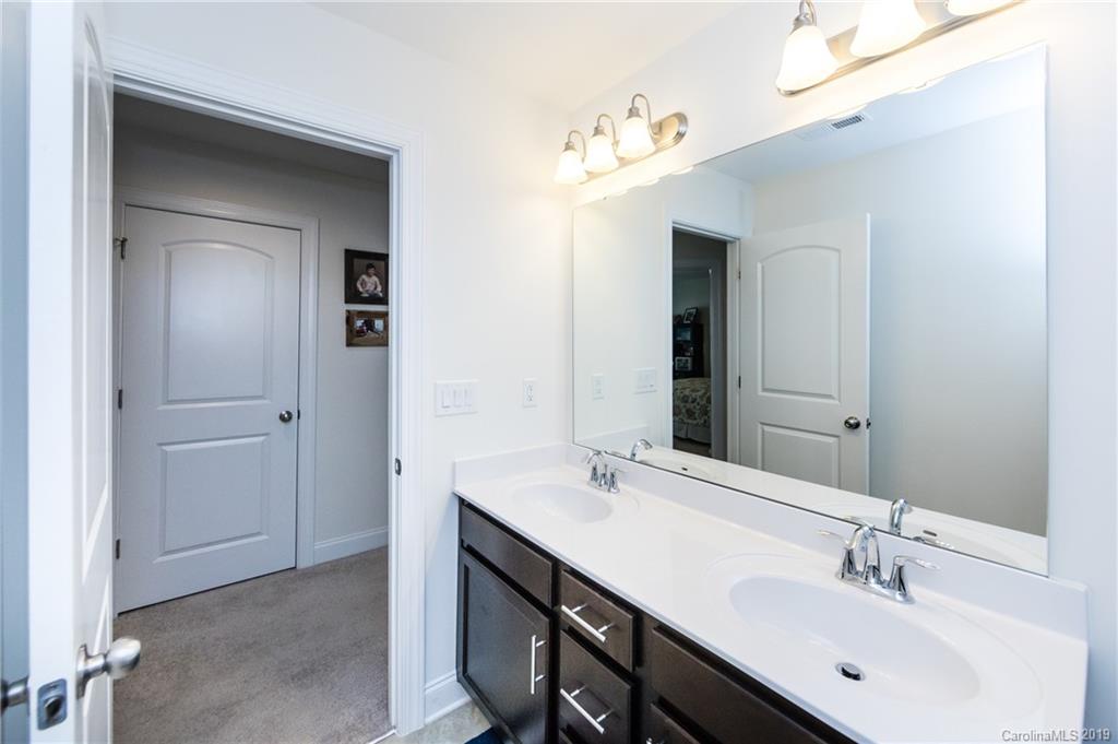 213 Morgan's Branch Road Belmont, NC 28012 - Photo 28 of 41 a bathroom with a double vanity sink mirror and
