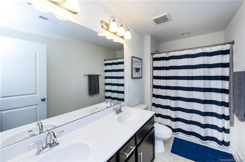 213 Morgan's Branch Road Belmont, NC 28012 - Photo 29 of 41 a bathroom with a sink and a mirror