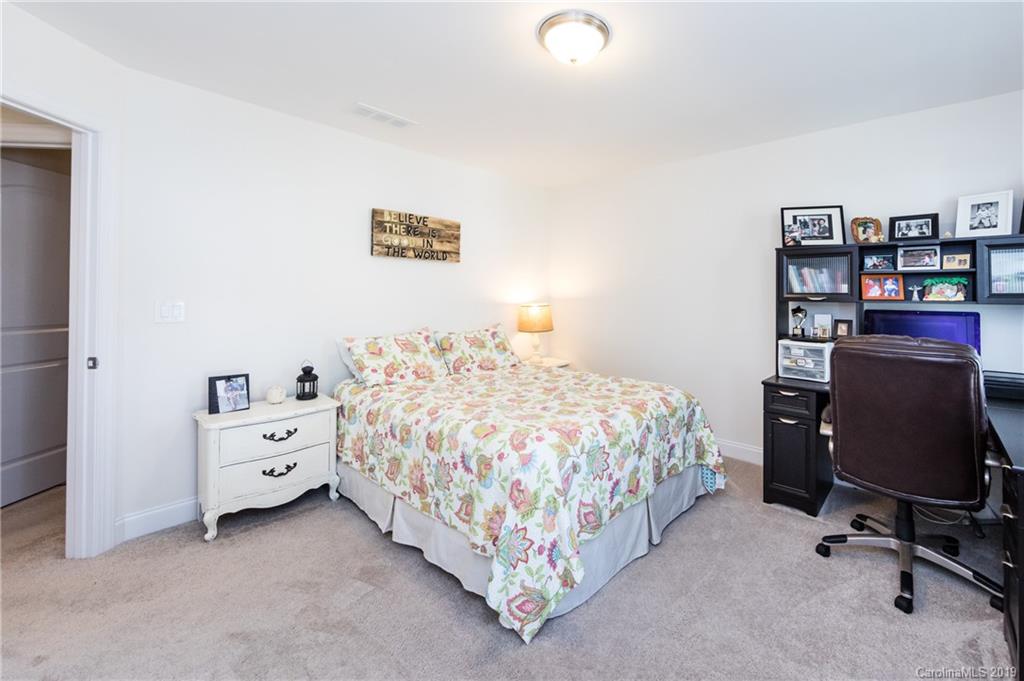 213 Morgan's Branch Road Belmont, NC 28012 - Photo 30 of 41 a bed room with a bed and a chair