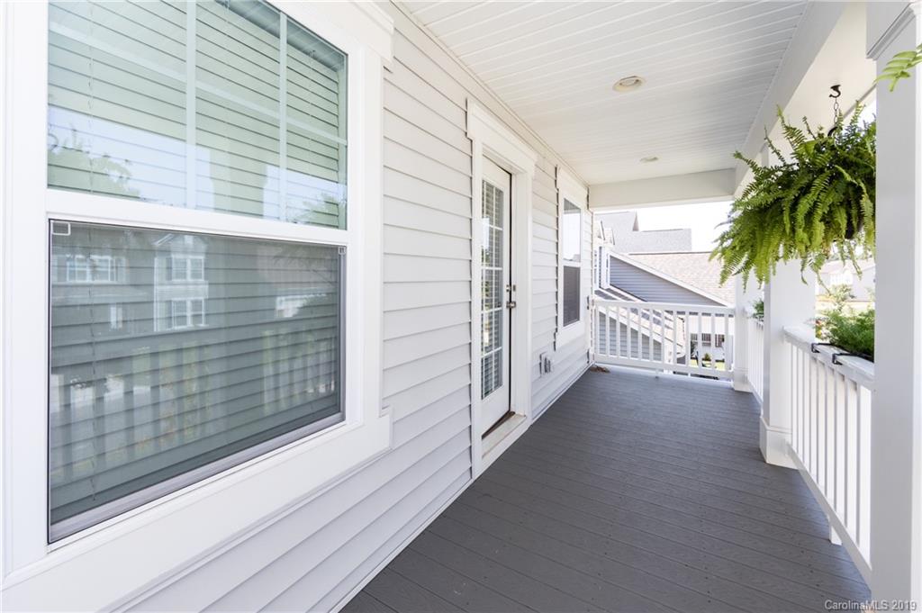 213 Morgan's Branch Road Belmont, NC 28012 - Photo 35 of 41 a view of a porch with a table and chairs and potted plants
