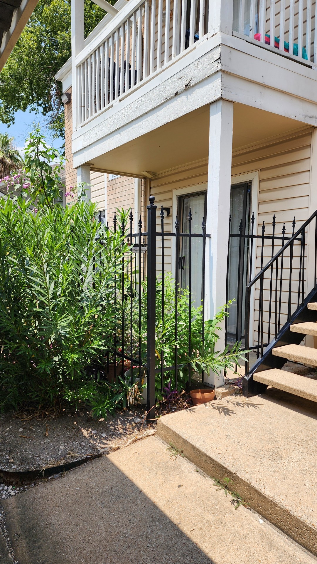 2750 Holly Hall Street, Unit 101 Houston, TX 77054 - Photo 6 of 6 a view of a building with garden